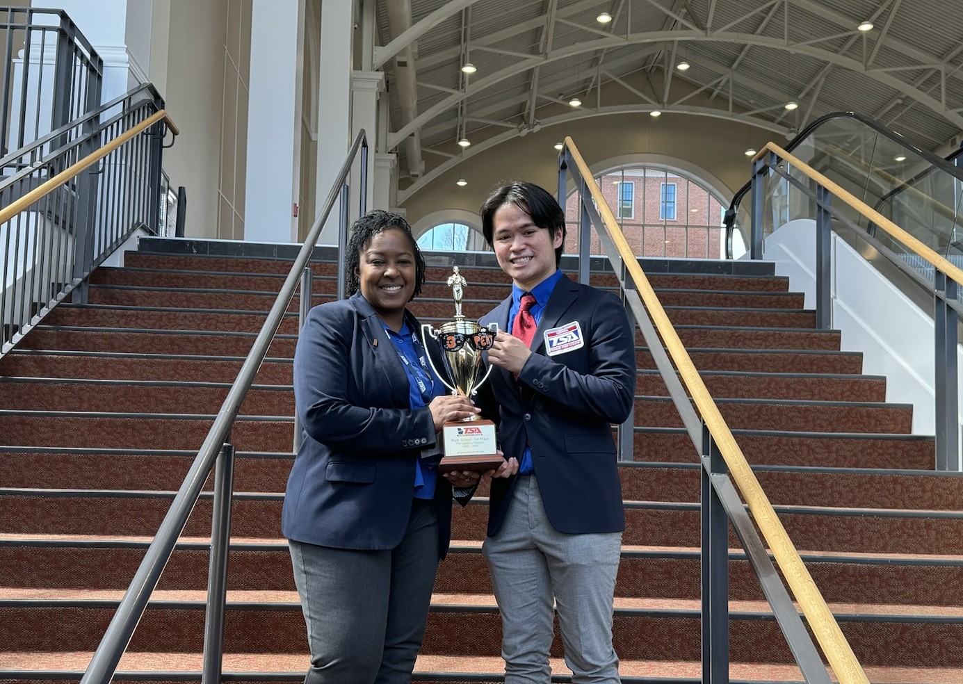 me and my technical advisor celebrating our first place overall win